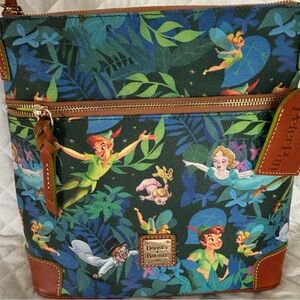 Dooney & Bourke never used Disney Peter Pan  crossbody.  In pristine condition.